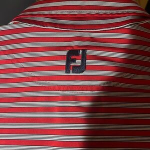 An extra large foot joy, golf shirt with red and blue and white stripes